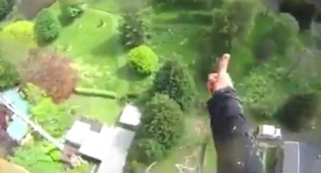 Guy Expertly Fells a Tree Between Neighboring Houses From 100+ Feet in the Air