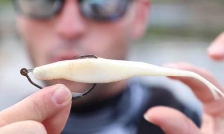 Watch This Guy Go Fishing with Crusty Lost Lures Found on the River Bottom