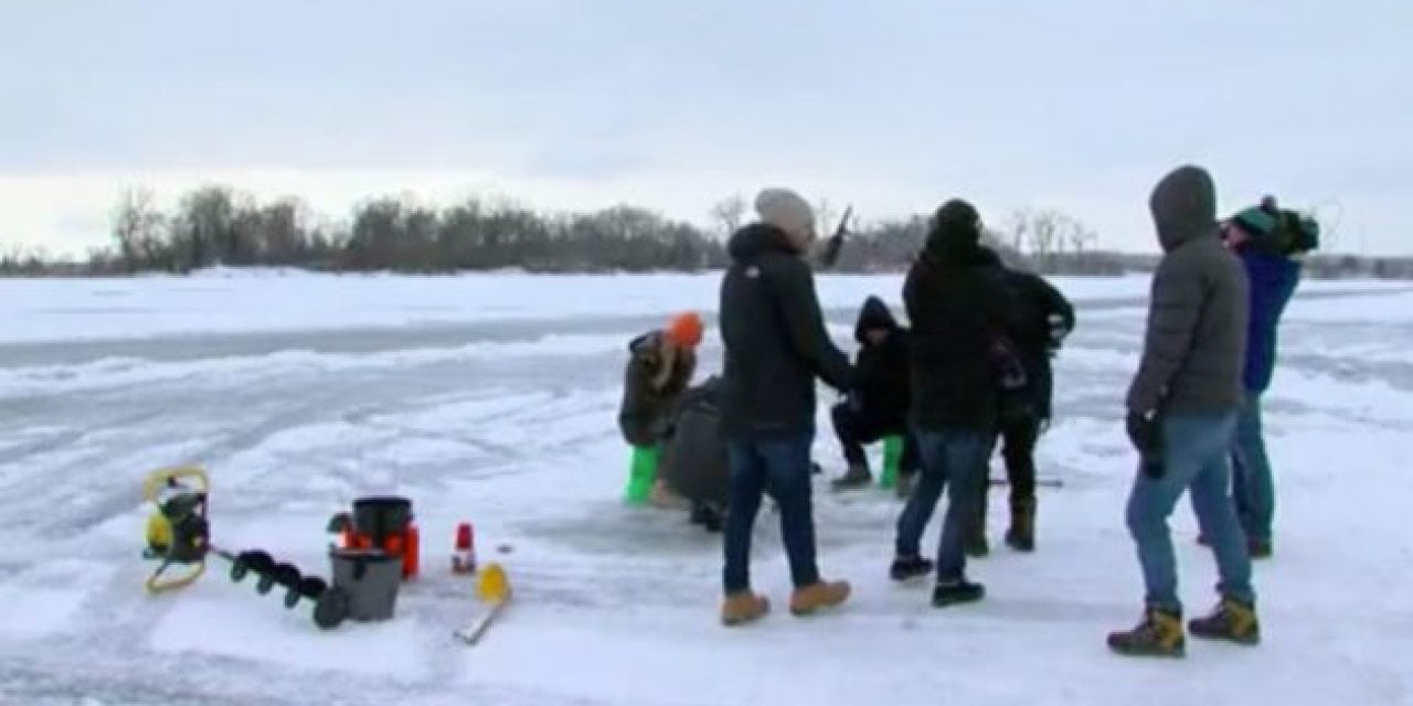 Tourists for the Super Bowl Captivated by Ice Fishing