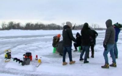 Tourists for the Super Bowl Captivated by Ice Fishing