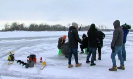 Tourists for the Super Bowl Captivated by Ice Fishing