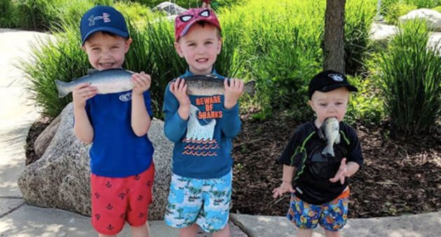 boy puts fish in mouth