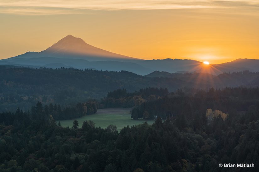 image of sunburst effect over the horizon