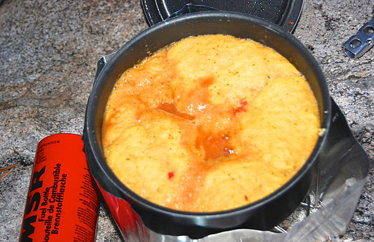 Salsa soup covered in corn dumpling