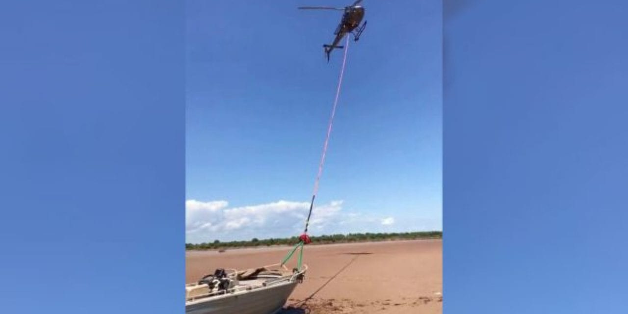 Helicopter Drags Stranded Boat Back to the Water