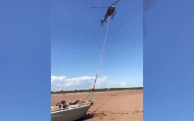 Helicopter Drags Stranded Boat Back to the Water