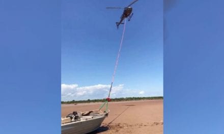 Helicopter Drags Stranded Boat Back to the Water