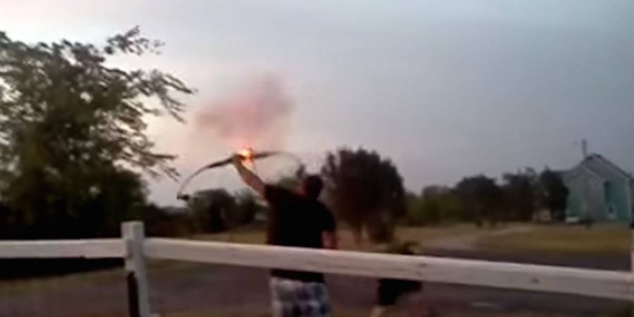 Guy Lights an Artillery Shell on the End of an Arrow