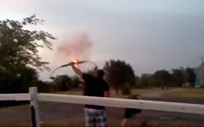Guy Lights an Artillery Shell on the End of an Arrow