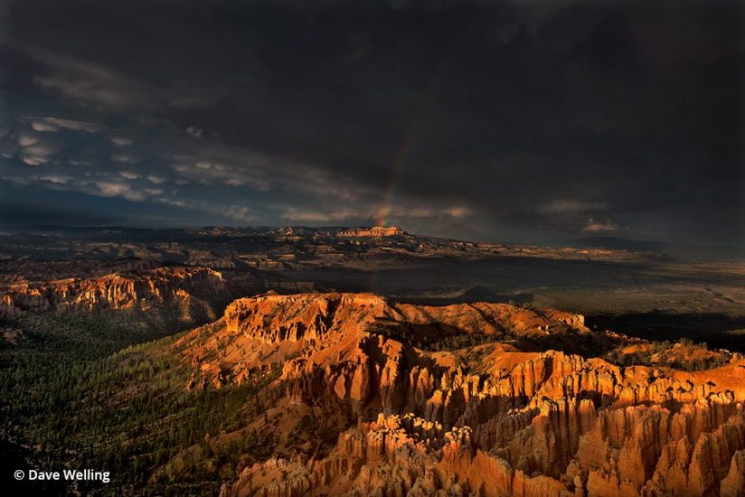 Monsoon photo of a rainbow over Bryce Canyon.