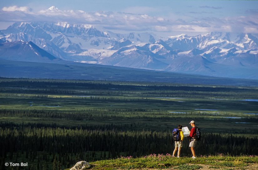 adventure photography, image of hikers checking a map