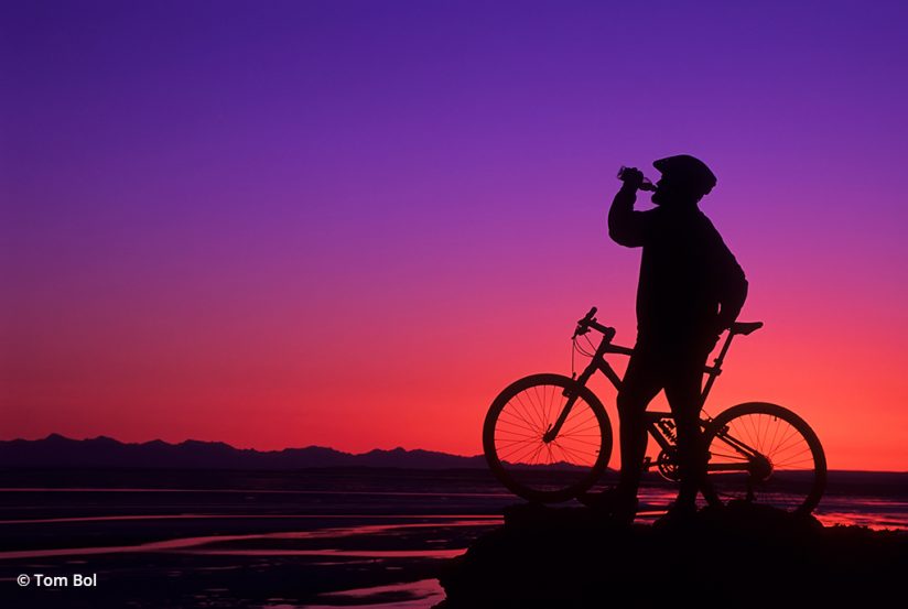 adventure photography, biker at sunset