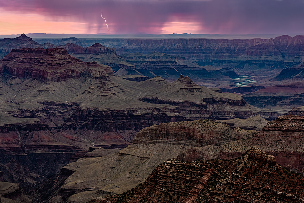 A photograph of lightning at sunset.