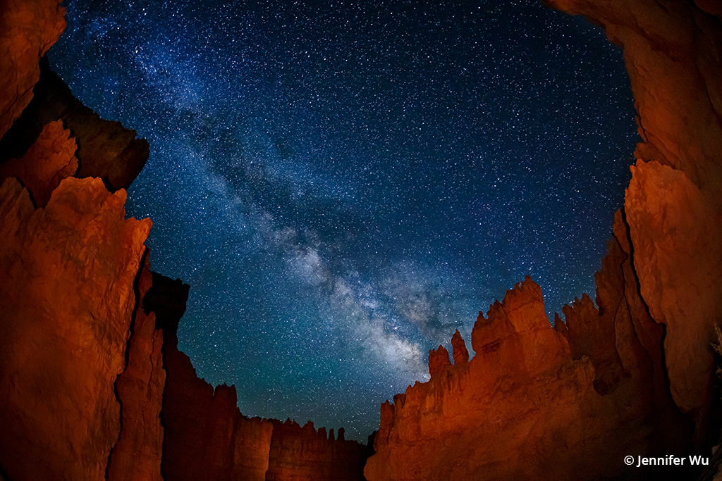 Photo of the night sky above canyon walls in Bryce Canyon National Park.