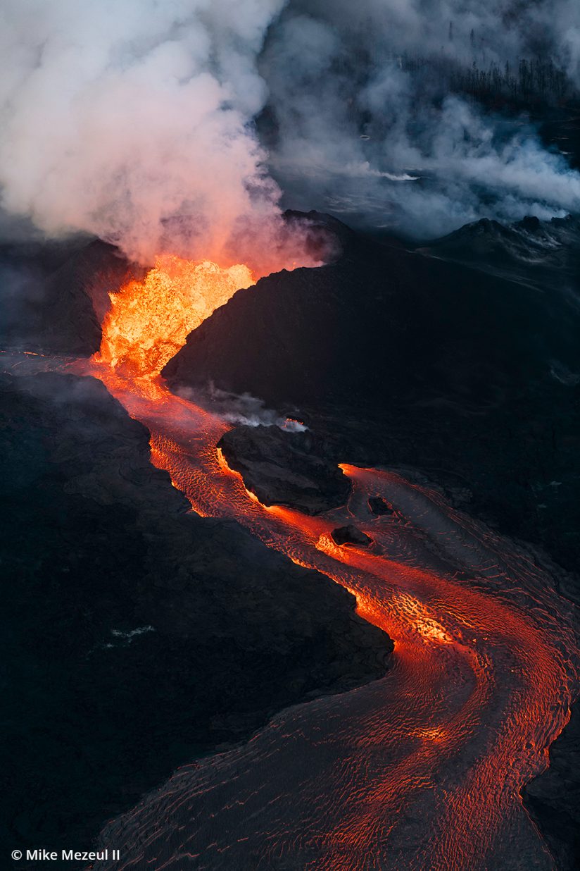 An aerial view via helicopter of Kilauea Fissure 8 erupting