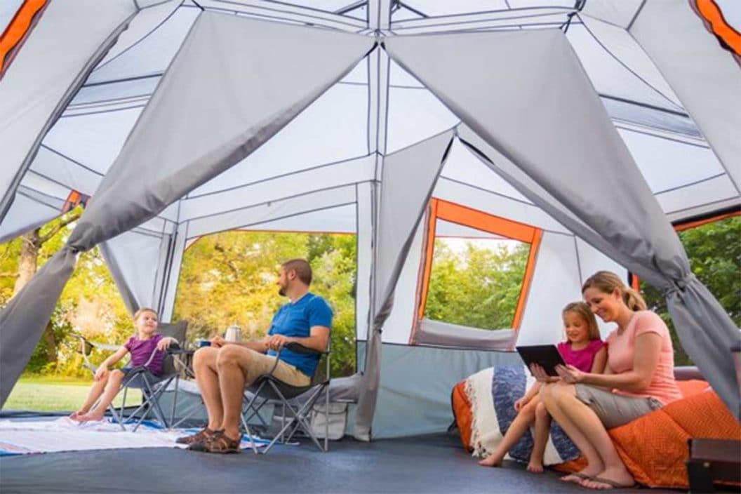 Family Sitting In Ozark Trail 12-Person 3-Room Instant Cabin Tent