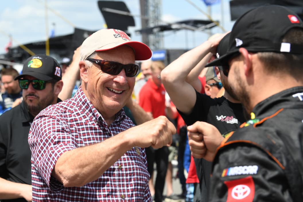 Johnny Morris, owner of Bass Pro Shops fist bumps a crew member for Martin Truex Jr (#19 Joe Gibbs Racing Bass Pro Shops Toyota) before the running of the NASCAR Cup Series Geico 500 on April 24, 2022, at Talladega Superspeedway in Talladega, AL.