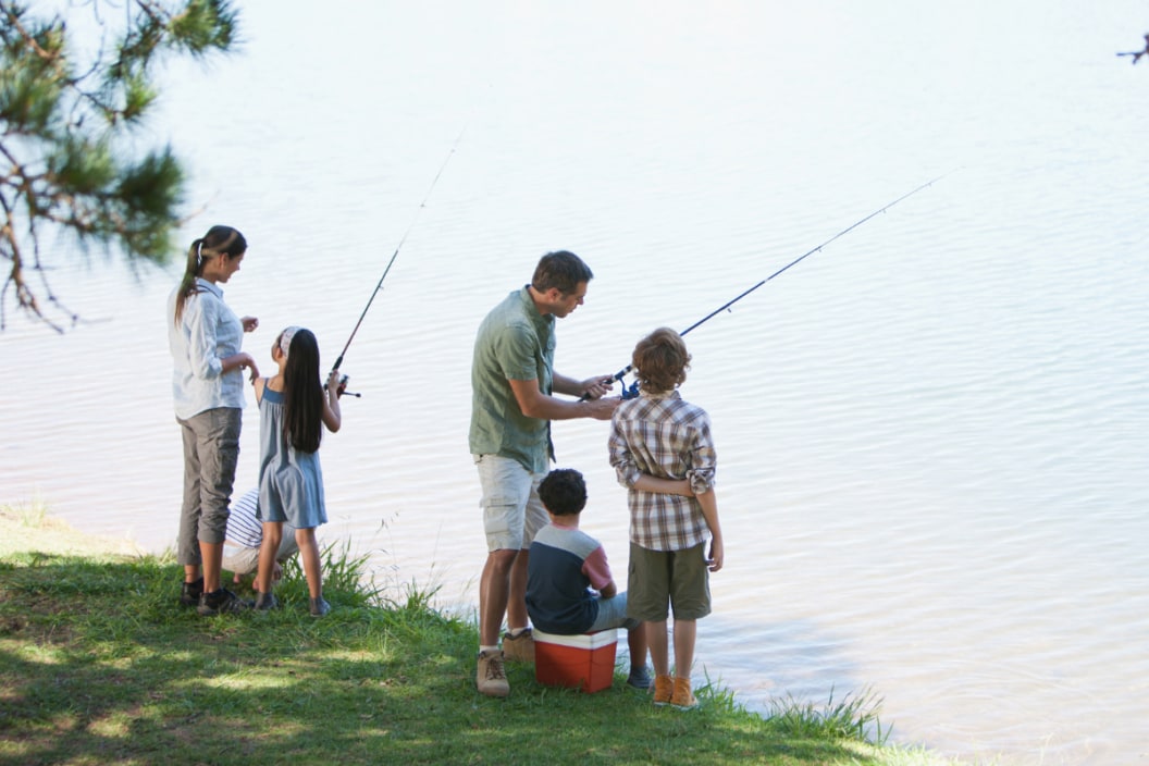 Family fishing lakeside