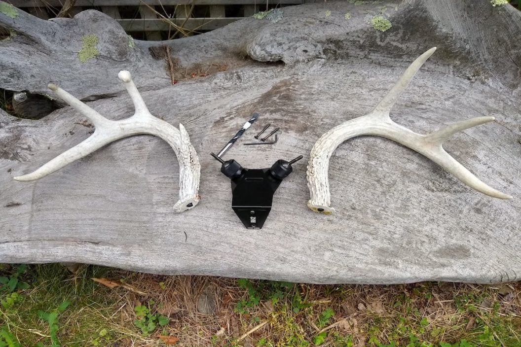 the Rack Hub RH2 system sits on a log between two antlers