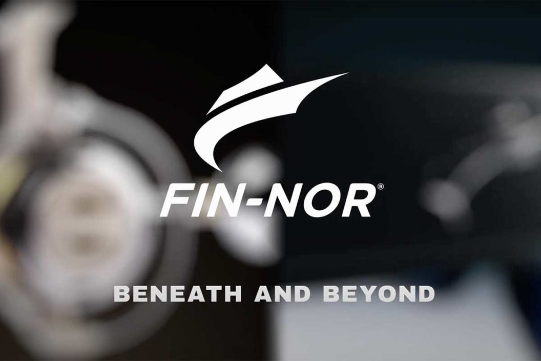 Fin-Nor logo with blurred fishing reel and sunglasses in the background