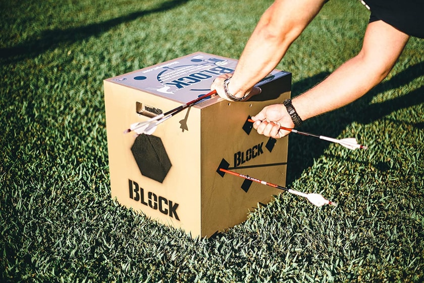 a person pulls arrows from the Block 6x6 Arrow Archery Target