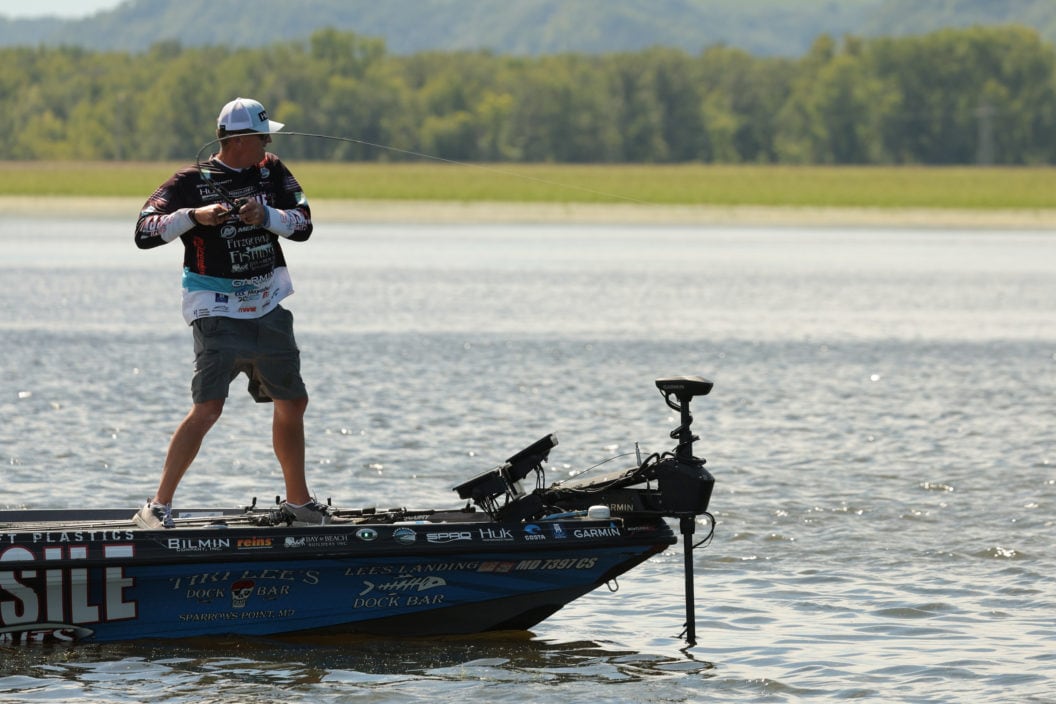 Pro angler sets the hook on a bass