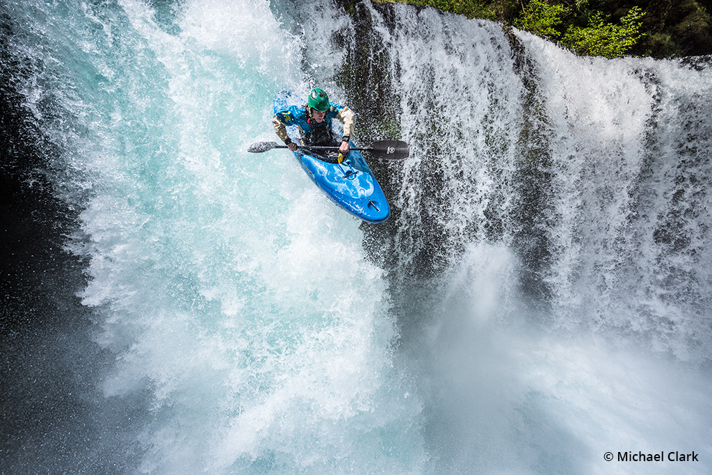Photo of whitewater kayaking over a falls
