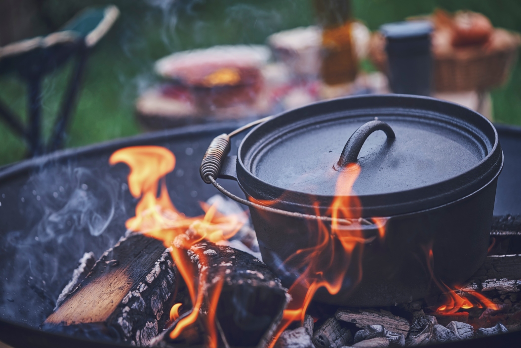 Cooking Chili Con Carne in Dutch Oven over Logfire Outside